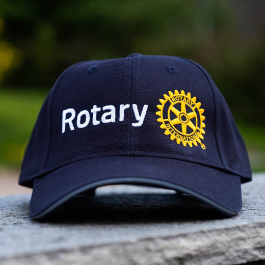 Capser med Rotary-logo
